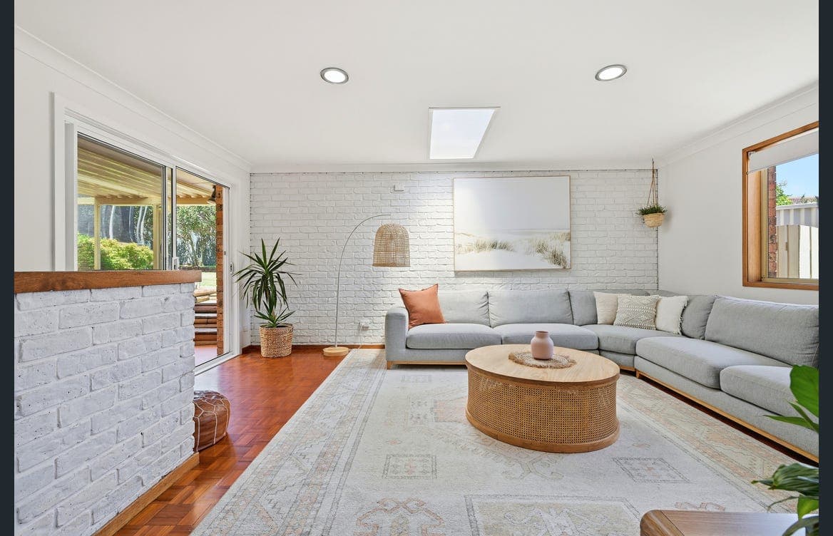 Spacious downstairs living room with plenty of comfortable seating for the whole group to unwind together